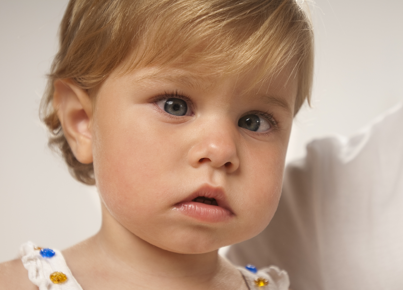 CLOSE UP portrait of adorable little girl with Amblyopia illness.